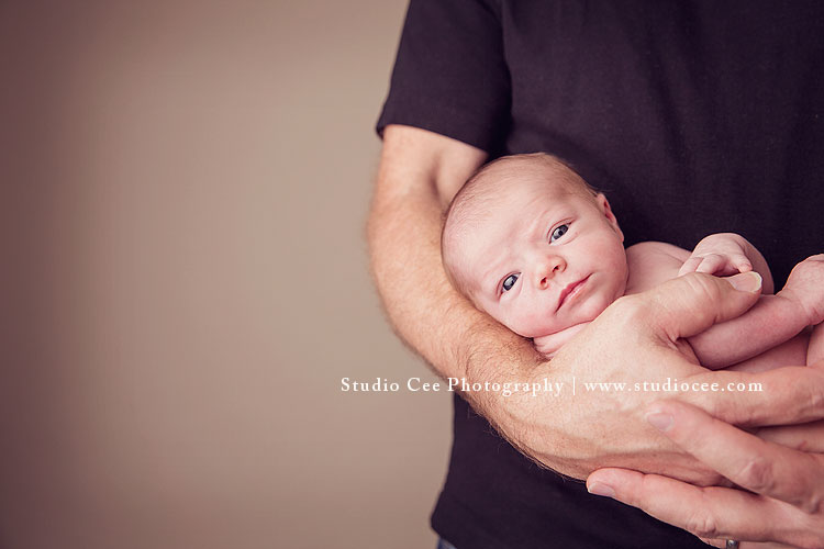 Adorable dad in hands newborn photography orange county